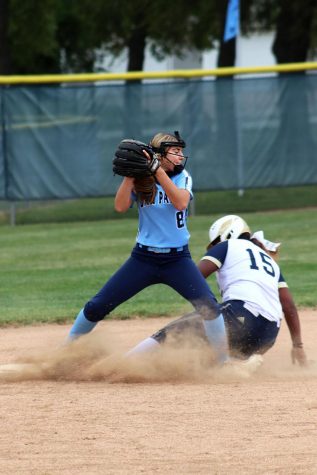 Sophomore Haley Brown catches the ball on  Wednesday, Sept. 9. This was Browns 11 year playing softball. My favorite thing about softball is getting to meet new people and play with my friends, said Brown.