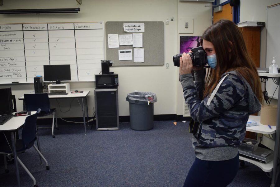MIPA SJOY winner, senior Abby Prywitch, Parkway Central High School, takes a photo.
