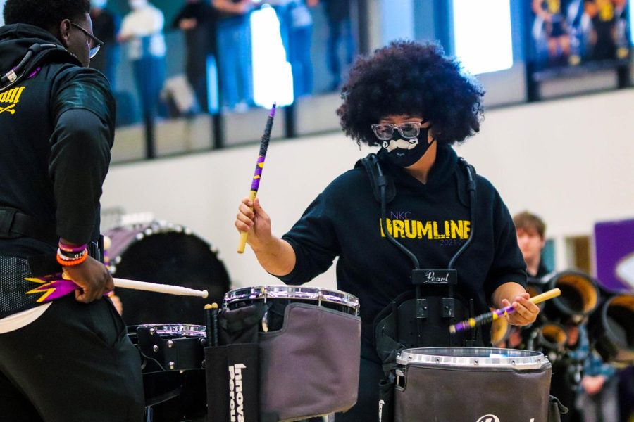 During the Black History Month Assembly on Feb. 25, junior Nicholas Yugmang engages in a drumline battle with freshman William Kweh. The pair faced off against each other and performed various drumming techniques.