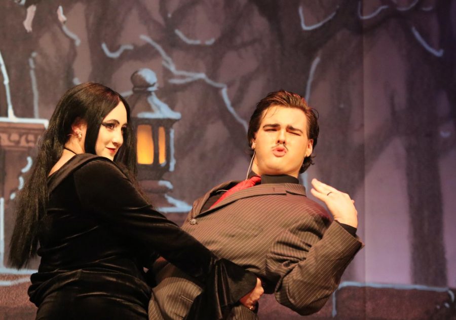 Junior Anastasia Jensen, playing Morticia, and junior Felix Reeder, playing Gomez, perform a salsa dance in the fall musical The Addams Family. The crowd burst into laughs after seeing Jenson dip Reeder at the end of the dance. This was such a fun experience, and being able to play Morticia was a dream of mine, Jensen said. 