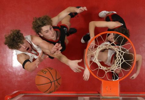 Richland sophomore Tucker Miller (left) puts up a shot over Dexter senior Logan Josupait during the second quarter of their contest on Monday night. Miller hit the bucket, but the Rebels never could get their offense going as the Rebels fell 84-30. With the loss for Richland and the win for the Bearcats, both teams’ records now stand at 4-2. The Rebels and Bearcats are both scheduled to play in the Bloomfield Christmas Tournament next week, with Dexter seeded in the No. 1 spot and Richland coming in at No. 12. 