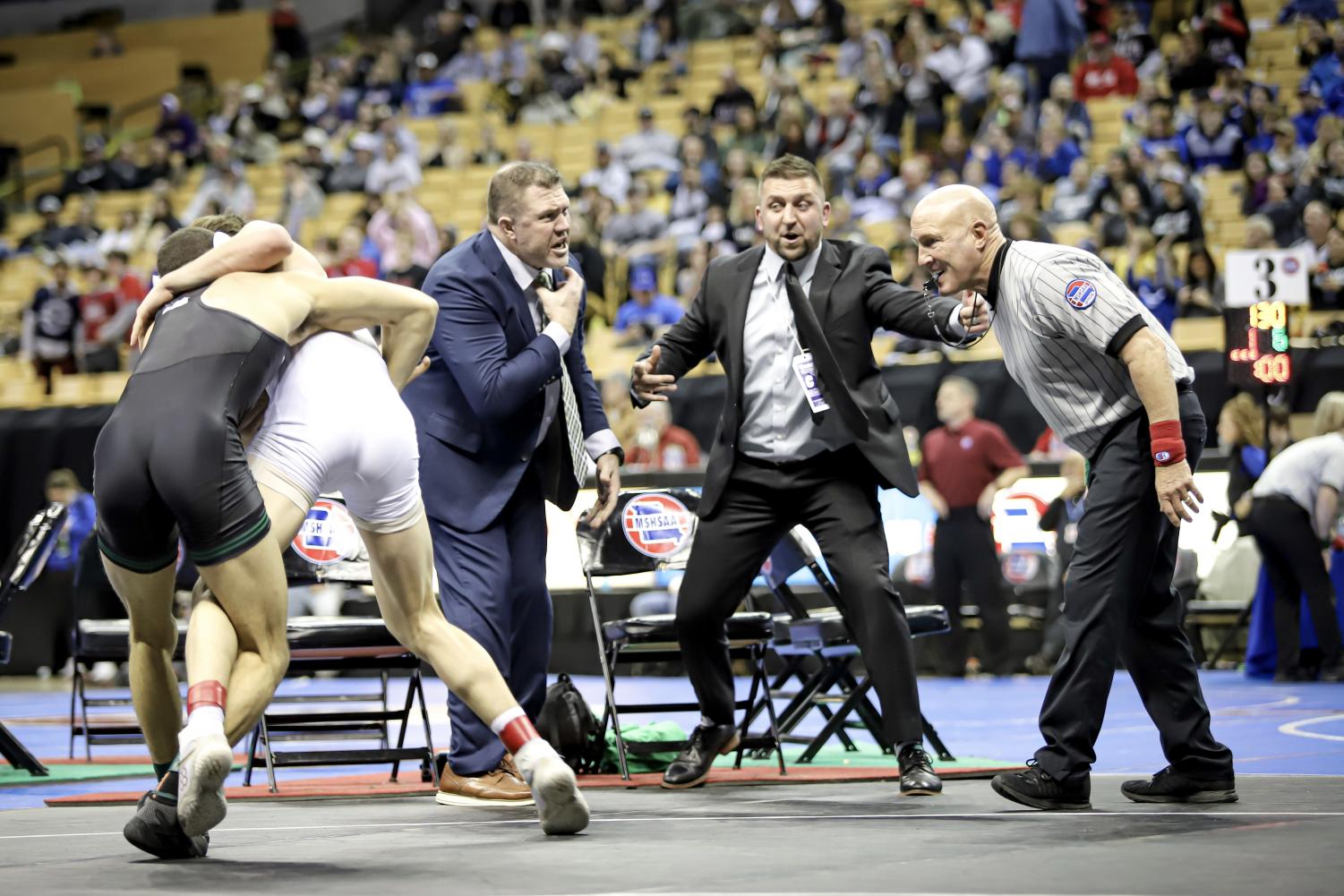 Alexander Hutchcraft (11) wrestles during the state finals. During the match many technical violations were not called leaving coaches angry. “Wrestling really defines who I am today. It’s physically built me and mentally pushes you,” said Hutchcraft. 