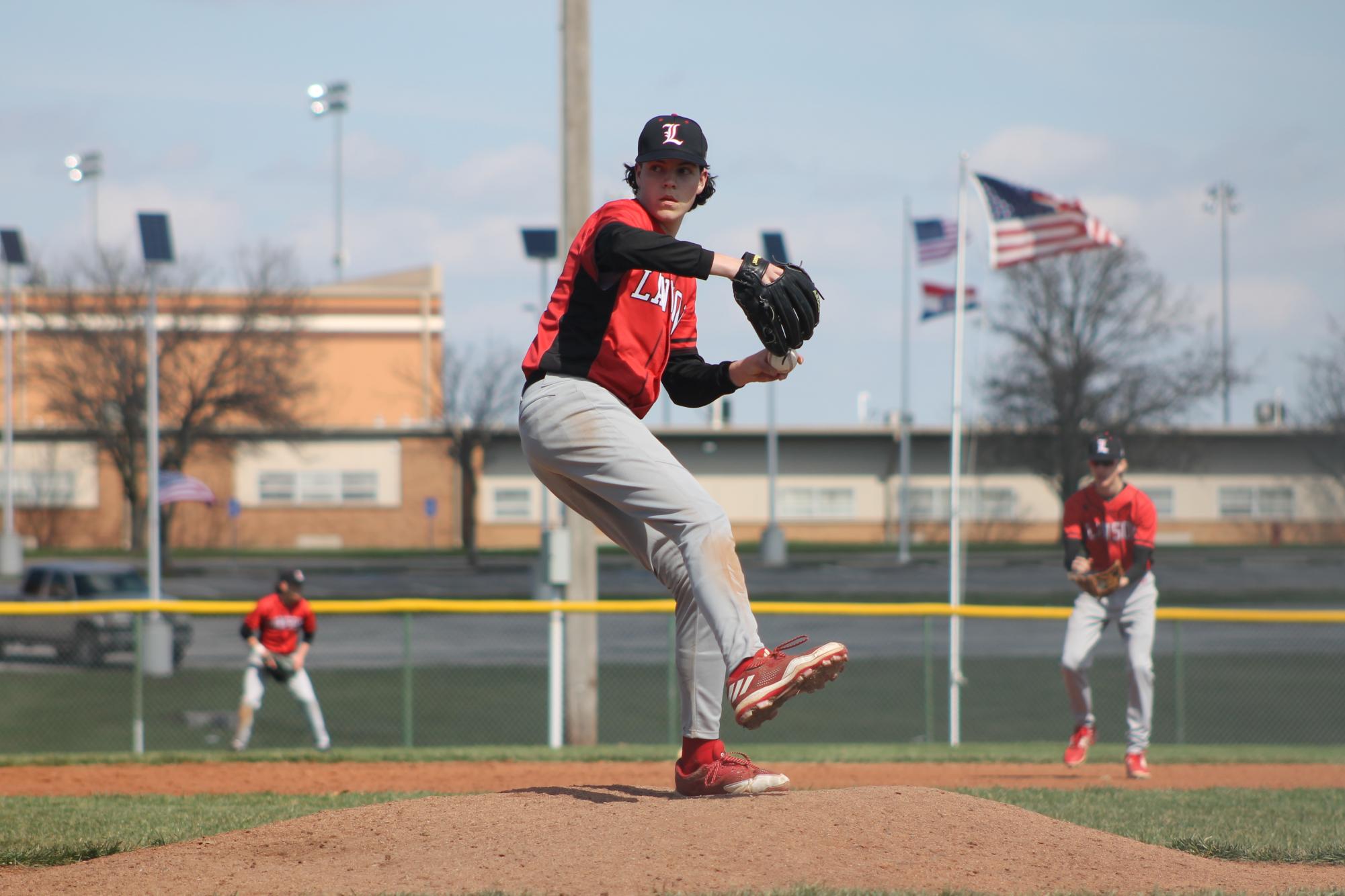 On March 16, junior Waylon Templeton pitches to the Lexington Minutemen batter in the second game of a varsity baseball double header. “I felt good going into the second game, Templeton said, and I trusted my defense.” Templeton led the Cardinals to a win, 15-5.